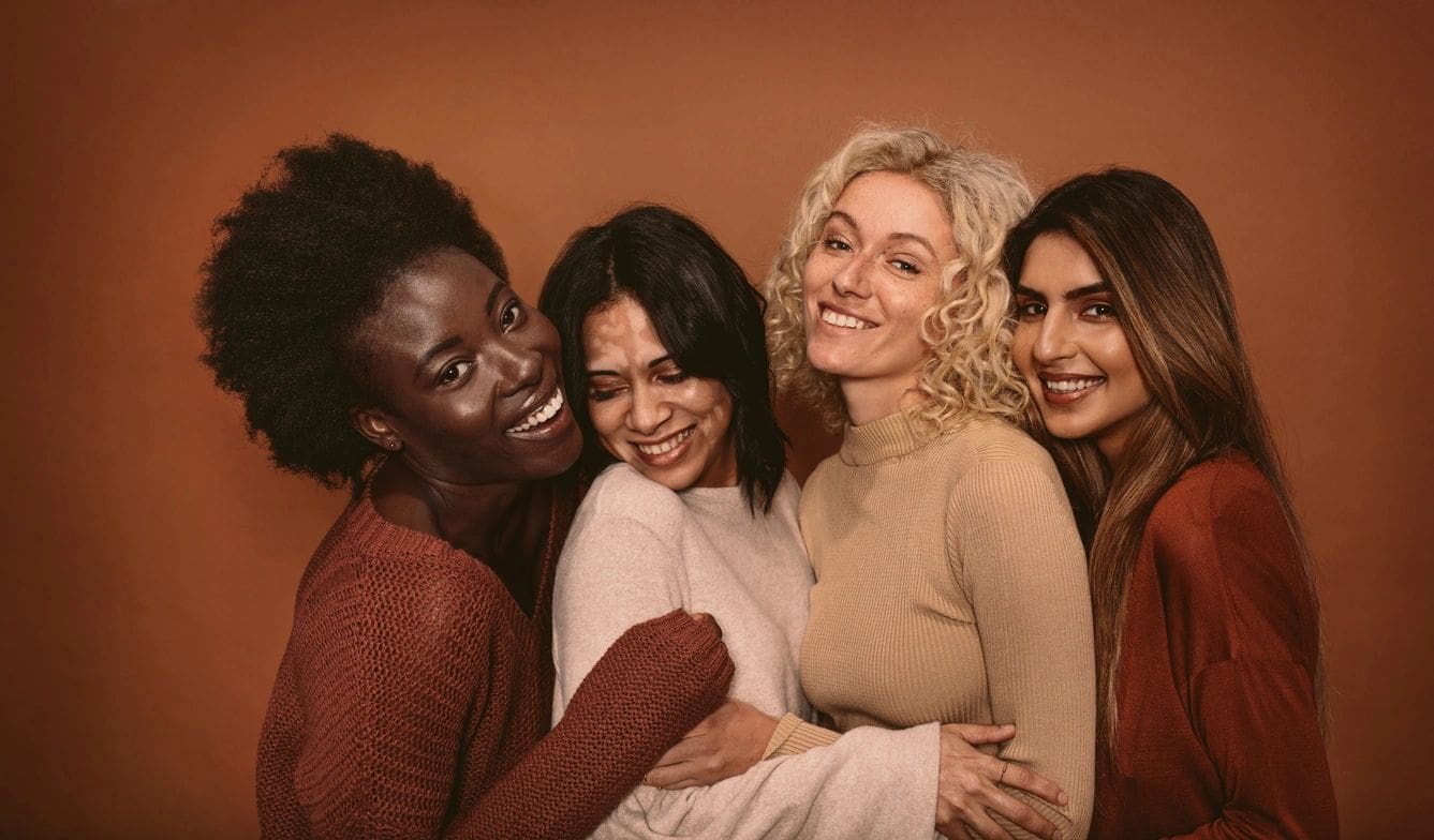 A group of women posing for the camera.